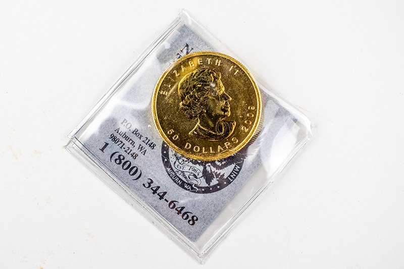 gold-canadian-maple-leaf-coin-front.jpg