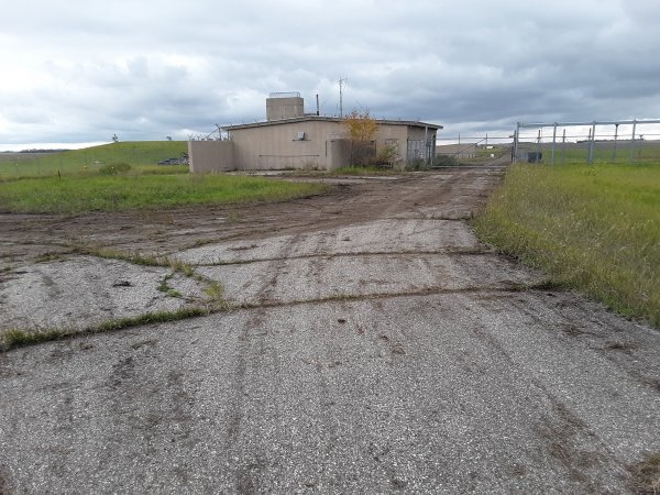 Security-building-E-paved-road.jpg